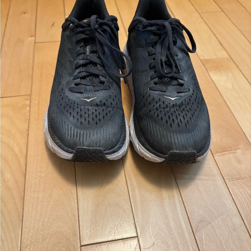 Black and Gold Hoka running shoes